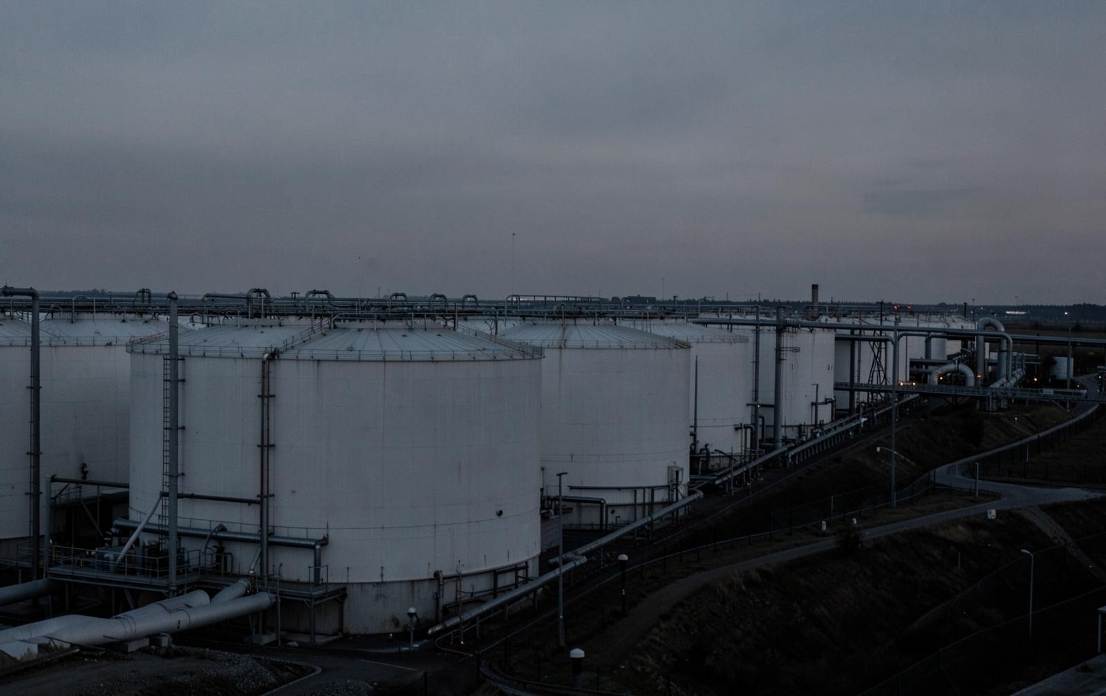 Crude oil storage tank farm at dusk